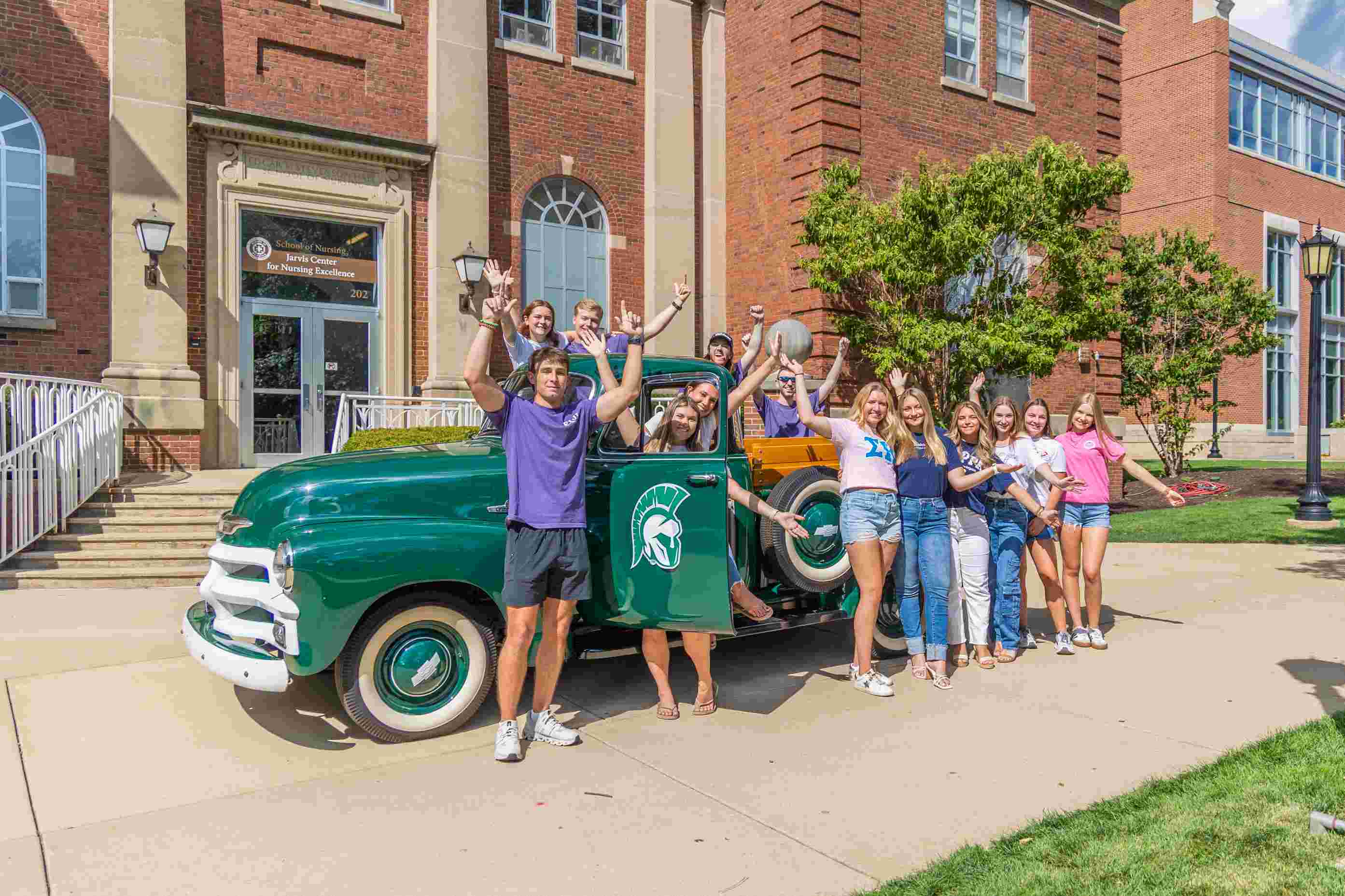 Greek life students on steps of State Farm Hall