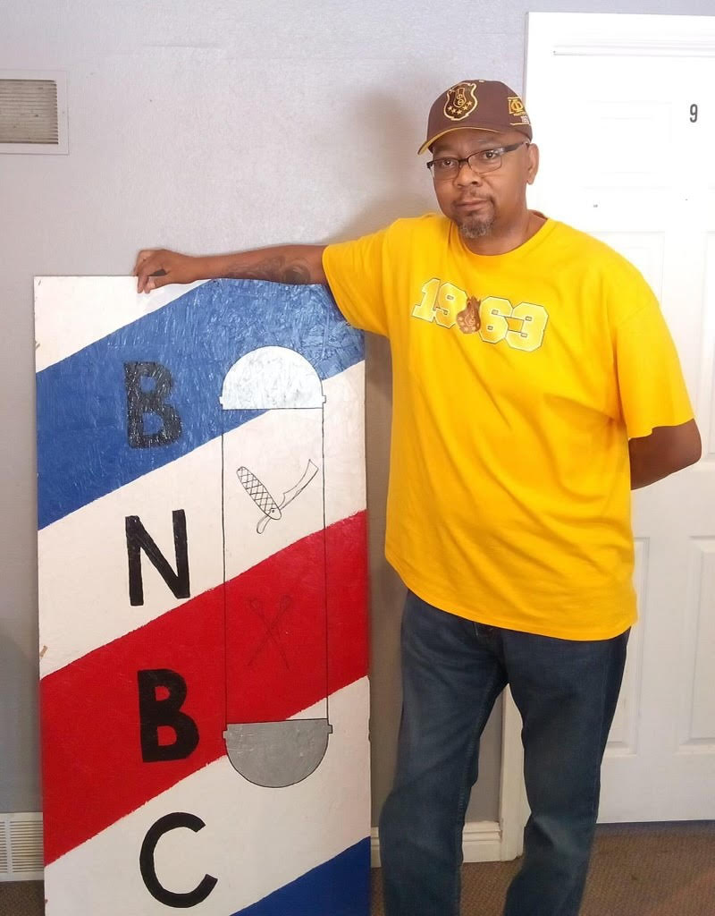 Cassius Crittendon Cassius Crittendon with BN Barber College sign