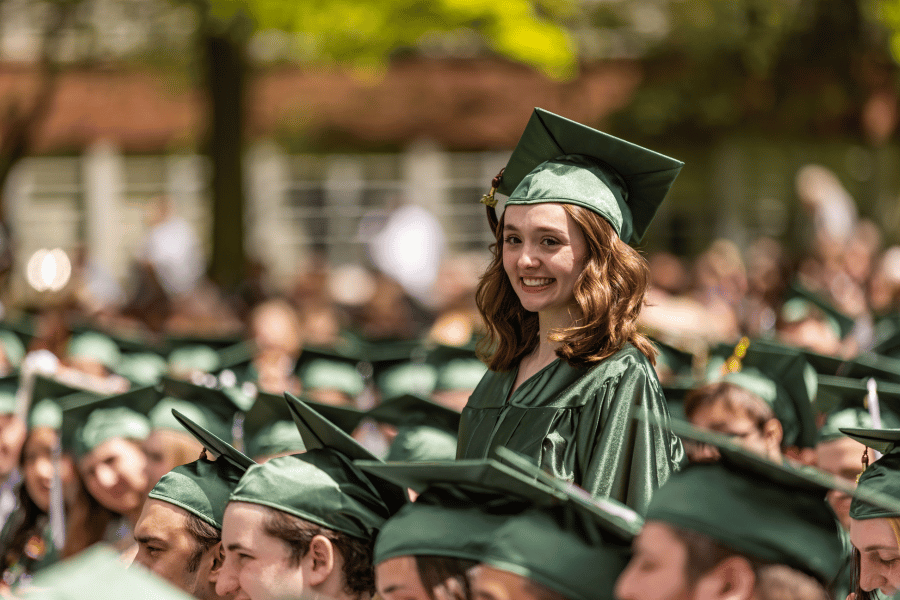 Commencement A student stands in the crowd during IWU graduation