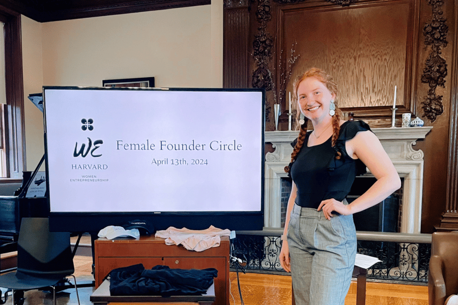Marissa Haggler Marissa Hagler in wood-paneled room at Harvard giving a presentation