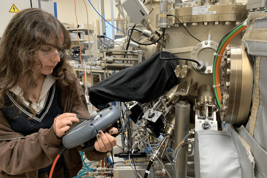 Wanda Wanda Lindquist controls the movement of a sample inside a molecular beam epitaxy machine at Argonne National Laboratory