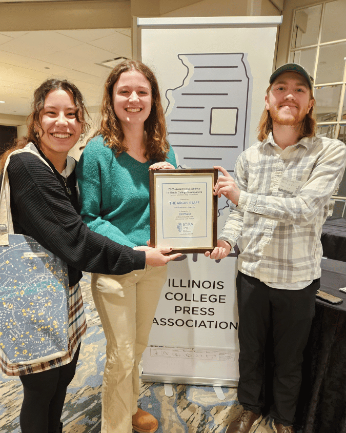 Argus Argus staff pose with certificate at the ICPA awards in chicago