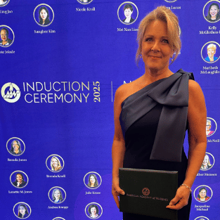 Associate Professor of Nursing Brenda Lessen Knoll at induction ceremony for fellow with American Academy of Nursing