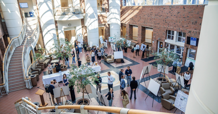 Students presenting research in the atrium of the IWU Center for Natural Sciences