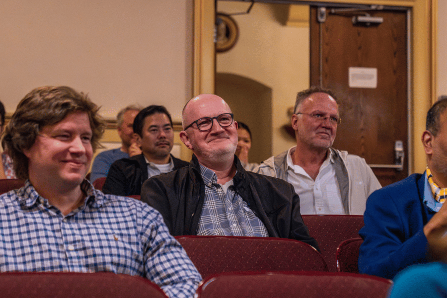 Professor of Biology Edgar Lehr smiles from the audience as he is named the 2026 Kemp Award Winner at IWU