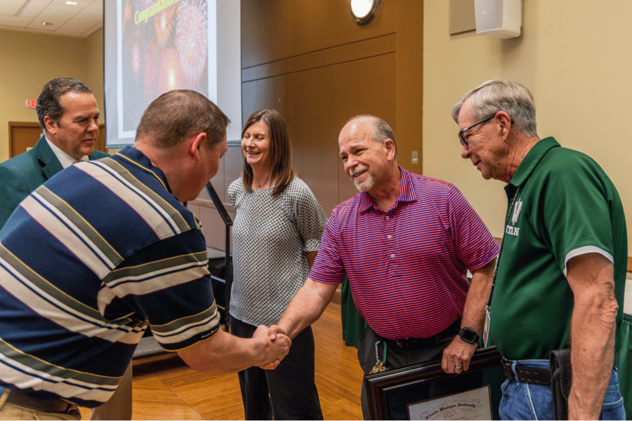 Randy Crow and Bob Rogers accept Starkey Award at IWU
