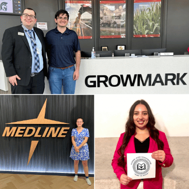 students posing with employer signs from summer internships