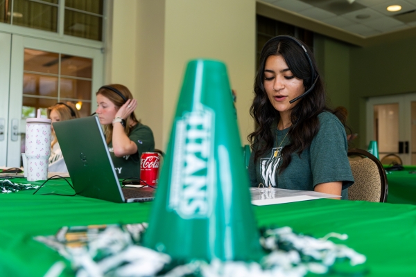 Students making calls for All In