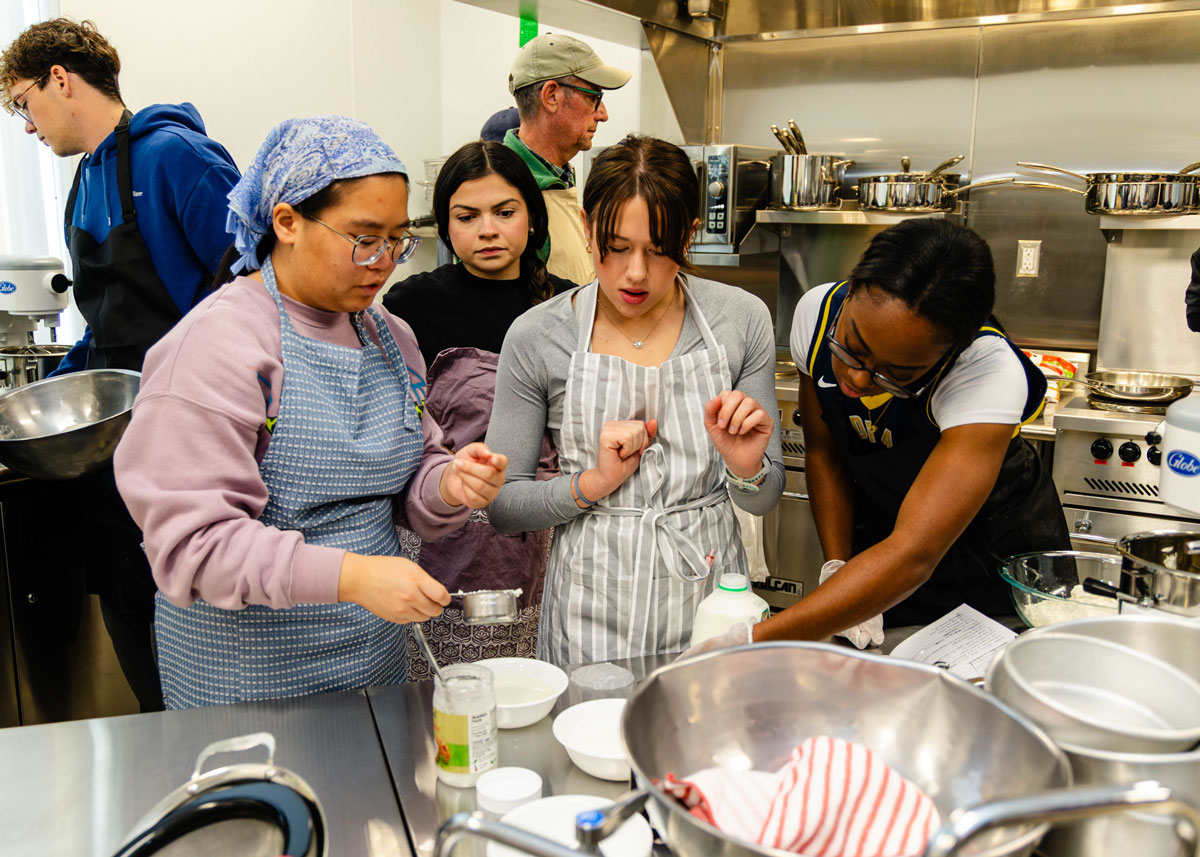 Group members work closely together to bake the best possible cake.