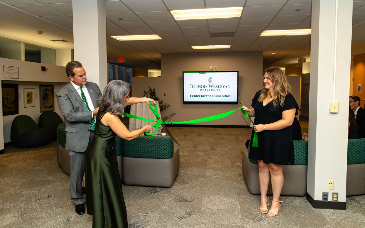 Joanne Diaz cutting the ceremonial ribbon at the Center for Humanities Ribbon Cutting and Reception