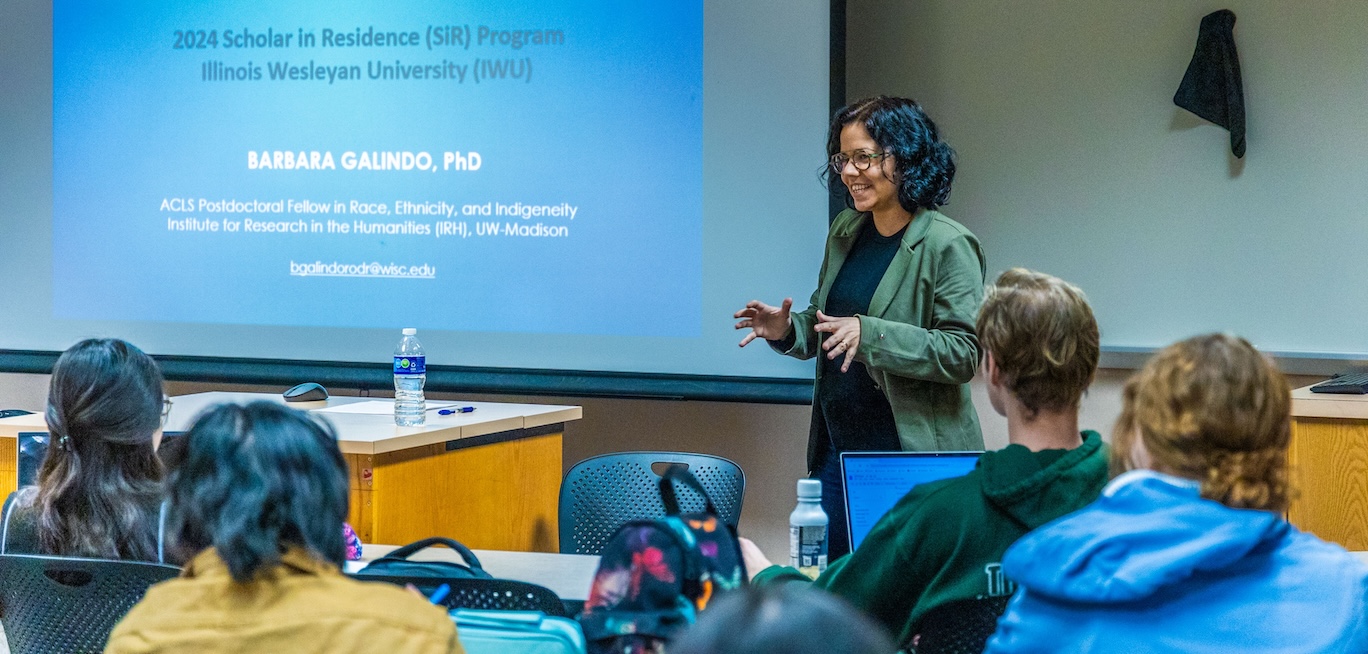 Barbara R. Galindo Rodrigues Marcos speaking to classroom of students.