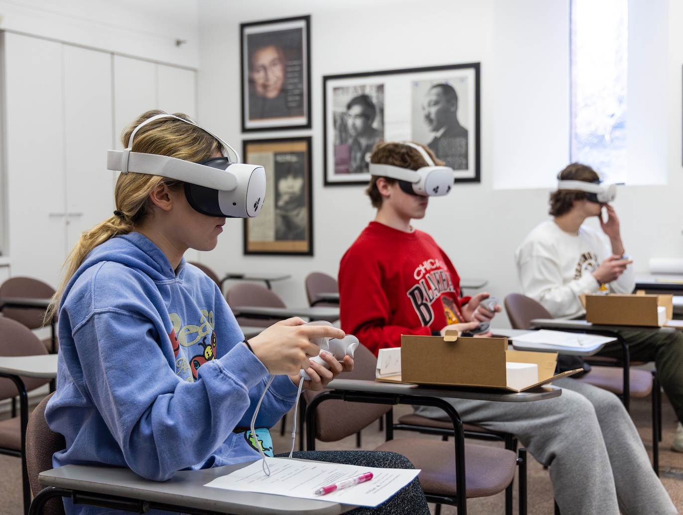 Students using Virtual Reality equipment in class.